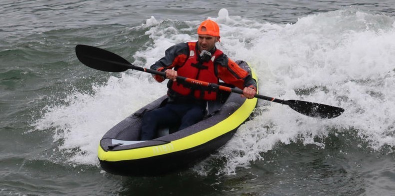 man in inflatable kayak