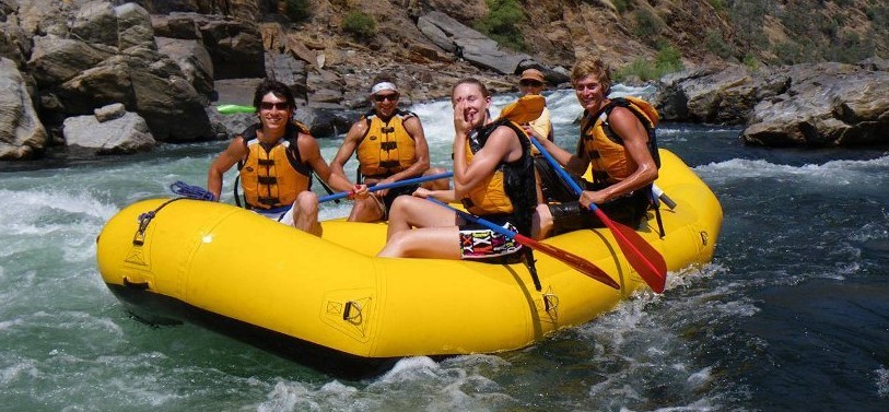 people in inflatable kayak
