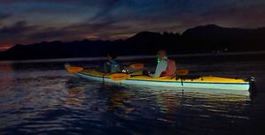 kayaks with lights on water